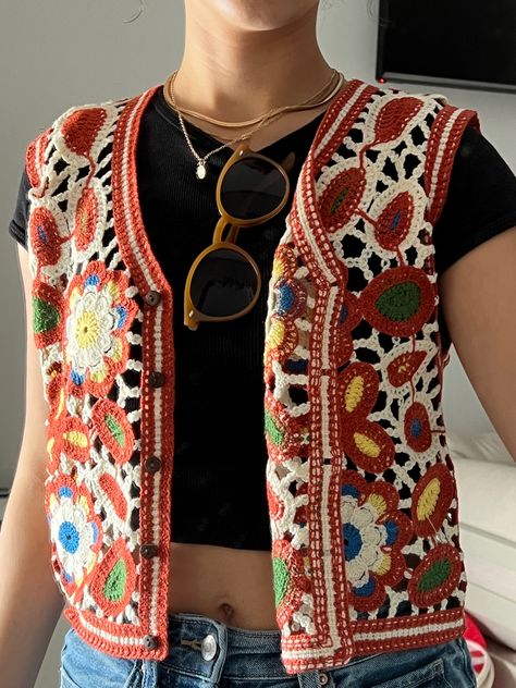 colorful crochet vest, gold accessories, sunglasses Yellow Crochet Vest, Sweater Vest In Summer, Crochet Vest Outfit Fall, Colourful Vest Outfit, Crochet Vest With Buttons, Summer Crochet Vest, Crochet Button Vest, Boho Vest Outfit, Crochet Button Up Vest