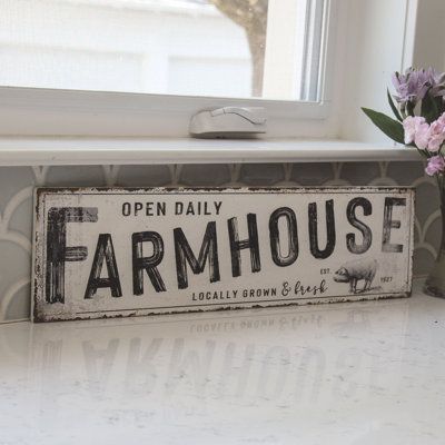 The retro Farmhouse Metal Sign makes a stylish addition to any home. This horizontal metal sign features white paint and a distressed look and texture. The sign reads "Farmhouse" in bold black painted letters, in addition to "Open Daily," "Locally Grown & Fresh" and "est. 1927", with pig art in the corner. This sign is a beautiful addition to any kitchen, fits especially well with modern farmhouse decor and includes two sawtooth hangers on the back for a wall display. Measures 6.5" high by 24" w Retro Farmhouse, Pig Art, Backyard Paradise, Painted Letters, The Farmhouse, Locally Grown, Modern Farmhouse Decor, White Paint, Bold Black