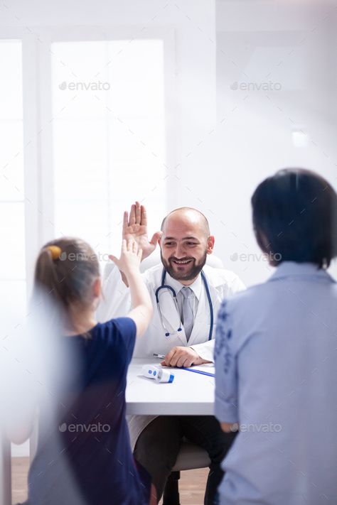 Doctor smiling at child by DC_Studio. Doctor smiling at child during consultation in hospital office. Healthcare physician specialist in medicine providing... #Sponsored #DC_Studio, #consultation, #hospital, #Doctor Surgeon Moodboard, Doctor Photoshoot Ideas, Medical Photoshoot, Clinic Photoshoot, Hospital Photoshoot, Pediatrics Doctor, Hospital Office, Doctor Images, Family Doctor