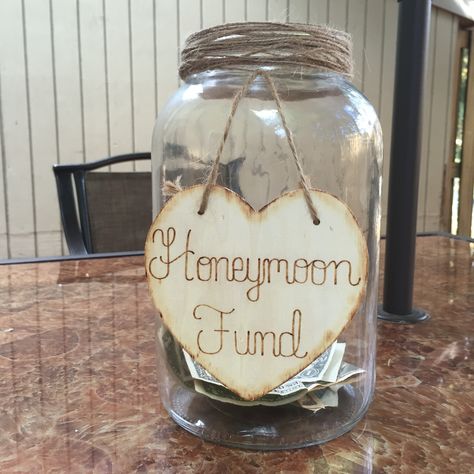 Honeymoon Fund- created with a mason jar, sign was ordered from Etsy. Perfect rustic look Wedding Money Jar Ideas, Diy Honeymoon Fund Jar, Honeymoon Fund Jar, Bridal Shower Favor Ideas, Rustic Bridal Shower Favors, Backyard Bridal Showers, Bridal Shower Menu, Diy Backyard Wedding, Country Bridal Shower