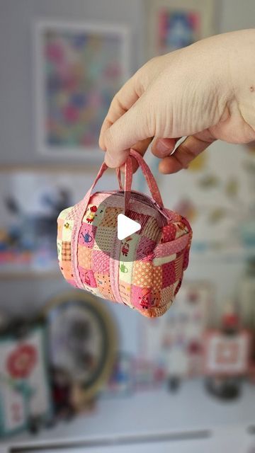 🌺ℝ𝕒𝕔𝕙𝕖𝕝 🌺 on Instagram: "I just couldn't resist making a micro mini duffle bag with the pattern from @knotandthread   I reduced the mini duffle pattern size by 75% and rounded to the nearest quarter inch on the measurements. It only took about an hour to sew as the regular size was fresh in my memory.   I'll be using this micro bag to store my lip balms. It makes me smile every time I look at it.   #scrappypatchwork #patchworkduffle #patchworkdufflemini #quilting #fabricstash #stashbusting #quiltedbag #quiltedproject" Mini Duffle Bag, Micro Bag, My Memory, Lip Balms, Micro Mini, Quilted Bag, Duffle Bag, The Balm, Quilting