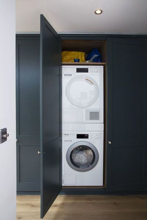 35 Smart Ways To Hide Washing Machine In Your Interiors | HomeMydesign Hallway Cupboards, Laundry Cupboard, Hidden Laundry, Utility Cupboard, Stackable Washer And Dryer, Downstairs Toilet, Bathroom Cleaning Hacks, Washing Machine And Dryer, Small Laundry