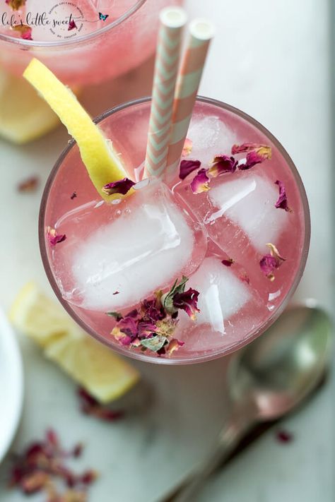 This Rosewater Lemonade is a thirst-quenching classic lemonade recipe with a fragrant and floral twist. Try this unique and beautiful lemonade for your next gathering! #rosewater #lemonade #drink #rose #roses #lemons #lemon #beverage #recipe #sweet Classic Lemonade Recipe, Rose Drink, Cold Drinks Recipes, Edible Rose Petals, Lemonade Drink, Lemon Cocktail, Rose Lemonade, Edible Roses, Rose Recipes