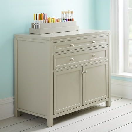 Comprised of unique storage solutions, functional work spaces and special places to curate and display children's art, the Martha Stewart Crafting Kids' Collection by Guidecraft inspires a child's artistic expression. Innovative designs along with quality pieces, together establish a comprehensive, child-centered space to create using a variety of media. Constructed from a durable combination of easy-to-clean solid pine and engineered wood, the Kids' Artwork Storage - Gray calms the chaos of any Art Supply Cabinet, Art Area For Kids, Kids Art Organization, Home Office And Craft Room Combo, Craft Cabinet Storage, Martha Stewart Craft Furniture, Cluttered Art, Art Storage Cabinet, Kids Artwork Storage