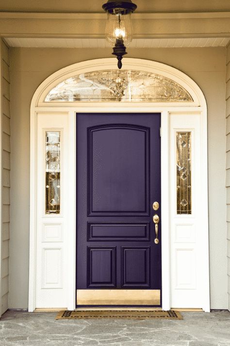 When purple is perfect it is downright majestic, you get Magetic Purple. This dark plum purple with gold accents really gives off a sense of royalty and regality. I’d imagine this door to appear almost black if the light isn’t hitting it. That’s why I like the metallic gold accents so much. Deep purple eggplant colored front door. SW Majestic Purple or Beauti-Tone Direct Line 436 #frontdoor #eggplant #purple #deeppurple Purple Front Door, Purple Front Doors, Front Door Color, Best Front Door Colors, Exterior Door Colors, Unique Front Doors, Best Front Doors, Front Door Makeover, Front Door Paint Colors