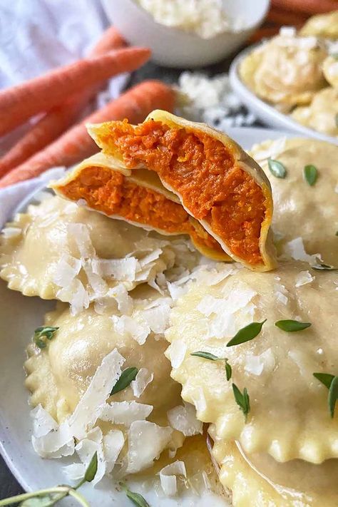 We'll never say no to any delicious vegetarian dinners! This homemade ravioli is no exception. The filling showcases a roasted carrot and shallot puree, cooked together on the same pan until deeply caramelized. We serve every plateful with a thyme brown butter sauce and cheese. Read more. #meatless #pasta #foodal Filling For Ravioli, Carrot Ravioli, Cooking Knowledge, Carrot Puree, Meatless Pasta, Brown Butter Sauce, Roasted Carrot, Course Ideas, Homemade Ravioli