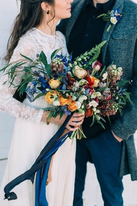 Perfect for an outdoor or bohemian wedding, a hand-tied bouquet is wildly arranged to achieve that “found in nature” effect. Get the look with lush blooms & unkempt greenery loosely tied with silk ribbon (or a bandana!). September Wedding Flowers, Birthday Flowers Bouquet, Metallic Wedding, Winter Wedding Bouquet, Winter Bouquet, Winter Wedding Flowers, Winter Bride, Rustic Wedding Venues, Maine Wedding