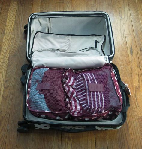 What is the Best Way to Pack One Week of Winter Clothes in a Carry-on? - Passport by Design Pack Winter Clothes One Suitcase, How To Pack Winter Clothes In A Carry On, Packing Winter Clothes In A Carry On, How To Pack Bulky Winter Clothes, Packing Sweaters In Suitcase, How To Pack Winter Clothes In A Suitcase, Winter Packing Carry On, Packing For Winter Travel, Packing Winter Clothes