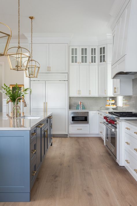 light wood flooring and white cabinets with blue island gold hanging pendants White Kitchen Wood Floors, Bathroom Transitional, Bedroom Transitional, Coastal Kitchen Design, Wood Floor Kitchen, Transitional Decor Kitchen, Classic Kitchen, White Kitchen Design, Coastal Kitchen