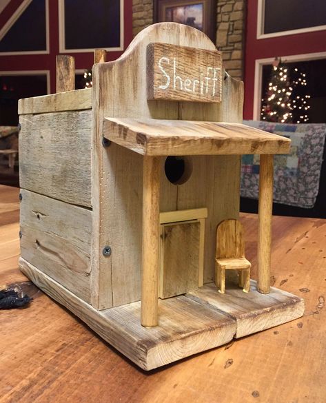 PRIMITIVE COUNTRY STYLE WESTERN SHERIFF’S OFFICE. Old western town style sheriff’s office birdhouse. Removable back panel for cleaning. #decorativebirdhouseplans Homemade Western Decor, Building Bird Houses, Western Sheriff, Cool Bird Houses, Old Western Towns, Birdhouse Projects, Homemade Bird Houses, Bird Houses Ideas Diy, Birdhouses Rustic