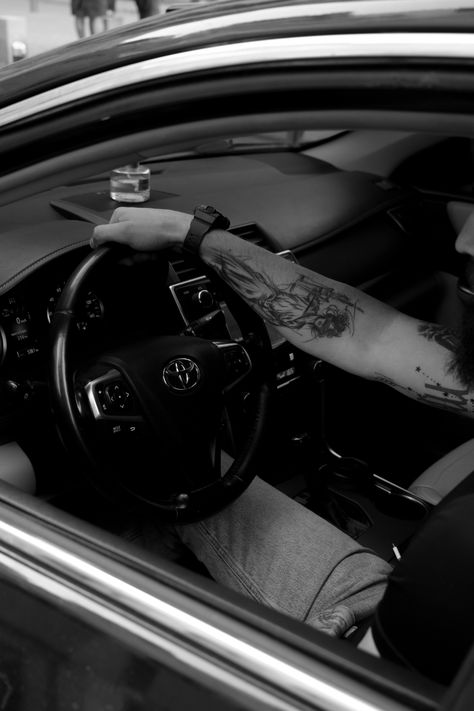 Male hands with tattoos holding a car steering wheel Hand On Steering Wheel Aesthetic, Tattooed Hands, Unique Perspective, Car Steering Wheel, Car Steering, Car Wheel, A Car, Hand Tattoos, The Journey