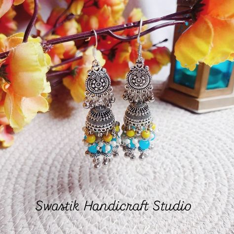 🌼Jhumka Swag 🌼 ...Cutest Jhumka ever....with anti -turnish hook... Detailing with combination of blue, yellow & white beads, Beautiful charms, & &&&&&& " Lots of Efforts & Live " ✨💞💞💟 ......Swipe left for Size 👉🏻👉🏻👉🏻 .. .. Shop on our website link in bio Or comment " link" to buy .. .. Handmade silver jewellery , unique silver Jhumka, Jhumka swag, Jhumka Collection , insta jewellery, unique handmade jewellery, jewellry haul, Best handmade silver earrings collection #silverjewelry #silver... Jhumka Collection, Handmade Silver Earrings, Bridal Necklace Designs, Indian Accessories, Handmade Silver Jewellery, Jewellery Indian, Silver Jewellery Indian, Jewellery Unique, Silver Earrings Handmade