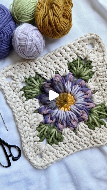 Caroline Langford - Floral Fiber Artist on Instagram: "Embroidery + crochet ✨  I’ve been wanting to experiment with embroidery in my work for a long time, and then I had the idea of combining it with a floral granny square - so here is my first attempt! I’ve already changed a couple things and I’m thinking about adding more, or possibly beads? I’m not sure yet, just taking it slow.  Thanks for all of your guesses about what this will be in the end - it’s going to be a wall hanging! 🤩  Love always, Caroline  #thehappyhomecollective #flowermacrame #floralmacrame #floralweaving #foreverflowers  #flowerweaving #handmadeisbest #etsyshop #crochetersofinstagram #floralgrannysquare #grannysquare #flowercrochet #processvideo #oddlysatsifying #flowerembroidery #paintingwithfiber" Chenille Granny Square, Floral Granny Square Crochet, Giant Granny Square, Floral Granny Square, Taking It Slow, Volume Spray, Flower Granny Square, Embroidery Crochet, Blanket Ideas