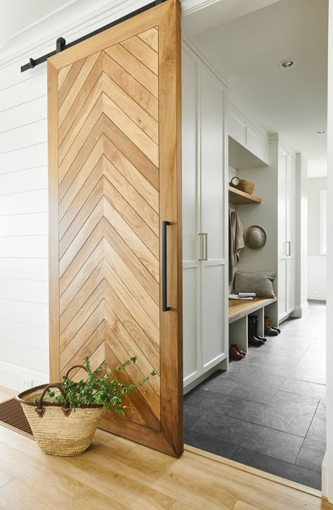 This mudroom gets the ability to be closed off from the rest of the house with the use of a sliding wood door that adds to the warm woods of the home. + sliding door ideas + barn door + mudroom barn door + mudroom cabinetry | Jenny Martin Design Barn Door Ideas, Wood Barn Door, Sliding Door Design, Modern Barn Door, Barn Door Designs, Custom Home Designs, Modern Barn, Door Designs, Beautiful Doors