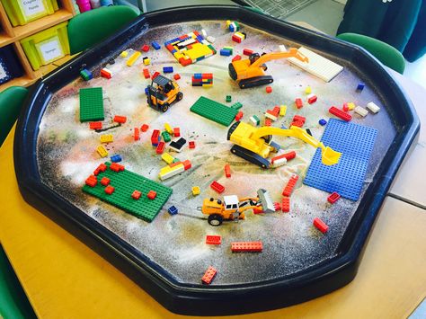 Construction themed tuff tray, with coloured sand, construction vehicles, Lego bases and Lego bricks. #TuffTray #TuffSpot #Construction Lego Tuff Tray Ideas, Quick Tuff Tray Ideas, Construction Tuff Tray, Tuff Table, Tuff Tray Ideas Toddlers, Tuff Tray Ideas, Messy Play Activities, Transportation Theme Preschool, Coloured Sand