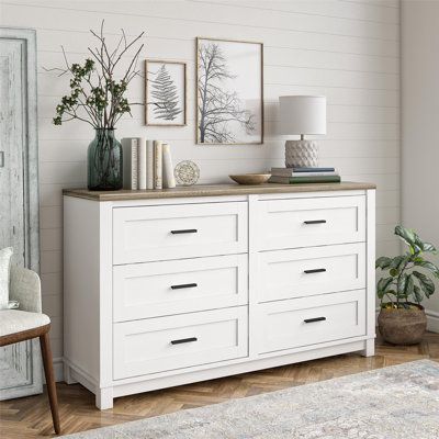 This double dresser perfectly combines style and functionality to give your bedroom the extra storage space it deserves. You won’t have to worry about cramming everything into the closet or digging around for your favorite shirt anymore. In addition to the extra storage, this product has a charming look that’ll fit into multiple décor styles. | Andover Mills™ Pettigrew 6 Drawer Double Dresser Wood in Brown/Gray/White, Size 32.0 H x 54.0 W x 15.75 D in | Wayfair White Dresser Wood Top, White Wood Dresser, White 6 Drawer Dresser, Farmhouse Dresser, Nursery Dresser, Dresser Top, White Dresser, Wood Dresser, Double Dresser