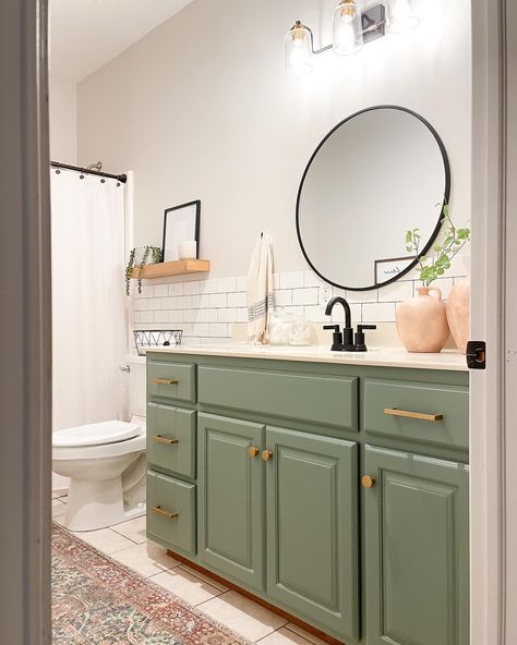 Bathroom vanity green gold subway tile black faucet round mirror Jewel Green Bathroom Vanity, Mint And Gold Bathroom, Pop Of Color Bathroom Vanity, Left Offset Bathroom Vanity, Bathroom Vanity Paint Colors, Sage Green Bathroom Vanity, Green Cabinets Bathroom, Light Green Bathrooms, Green Bathroom Vanity