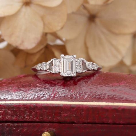 An Elegant Mid-Century Emerald Cut Diamond Engagement Ring💎 A gorgeous Emerald Cut diamond weighing 0.54 cts and assessed in the setting as G color and SI2 clarity is set between "half-hitch" styled shoulders set with eight round brilliant cut diamonds (total diamond weight 0.11 cts, GH color and VS-SI clarity. This beautiful vintage ring is a size 6.5 full and may be resized, please inquire. American made in Platinum. #leighjayandco #artdecoengagementring #vintageengagementring #artdeco... Emerald Cut Diamond Engagement Ring, Beautiful Rings Vintage, Emerald Cut Diamond Engagement, Emerald Cut Diamond, Art Deco Engagement Ring, Emerald Cut Diamonds, Vintage Ring, Round Brilliant Cut Diamond, Vintage Engagement Rings