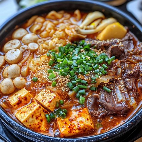 🥘🔥 Experience authentic Korean cuisine with Gopchang Jeongol—a rich and hearty hot pot filled with flavorful beef tripe! 🥩🌶️ #GopchangJeongol #KoreanHotPot Gopchang Jeongol (Beef Tripe Hot Pot) Ingredients: Beef tripe (300g, cleaned and cut into pieces) Mushrooms (100g, assorted, sliced) Korean radish (100g, sliced) Tofu (1 cup, cubed) Korean chili paste (Gochujang) (1 tbsp) Soy sauce (2 tbsp) Garlic (3 cloves, minced) Onion (1, sliced) Water (5 cups) Green onions (2, sliced) Sesame oil (1... Gopchang Recipe, Korean Hot Pot Recipe, Jeongol Recipe, Hot Pot Ingredients, Korean Hot Pot, Korean Beef Stew, Korean Radish, Korean Chili, Korean Chili Paste