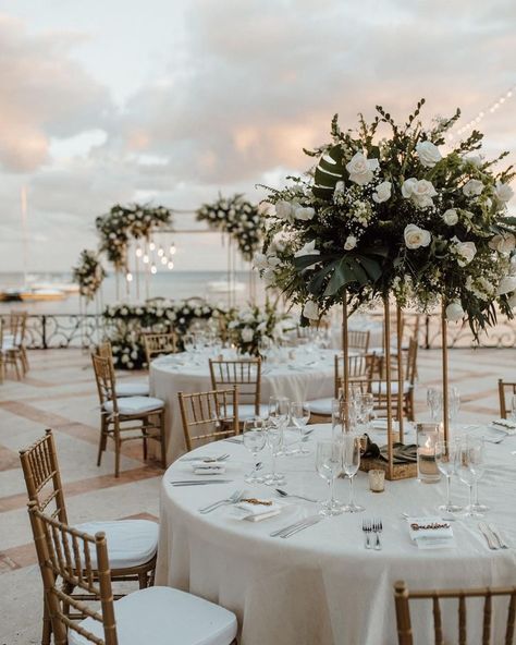 Wedding Themes Summer Indoor, Destination Wedding Table Centerpieces, Reception Florals Table Settings, High And Low Table Centerpieces, Reception Centre Pieces, Wedding Table Centerpieces Candles And Flowers, Romantic Beach Wedding Decor, High And Low Wedding Centerpieces, Elegant Themed Party