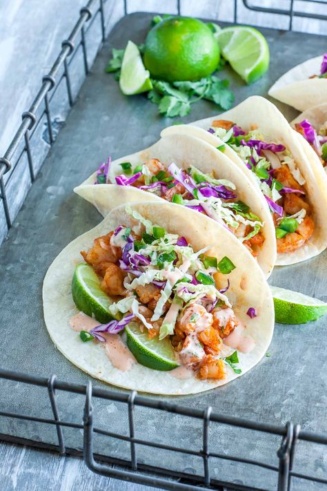 Spicy Sriracha Shrimp Tacos with Cilantro Lime Slaw :: fast, flavorful, and topped with a zesty Cilantro Lime Slaw that will rock yours socks off! Sriracha Shrimp Tacos, Spicy Shrimp Taco, Healthy Shrimp Tacos, Sriracha Shrimp, Lime Slaw, Shrimp Taco, Spicy Shrimp Tacos, Cilantro Lime Slaw, Shrimp Taco Recipes