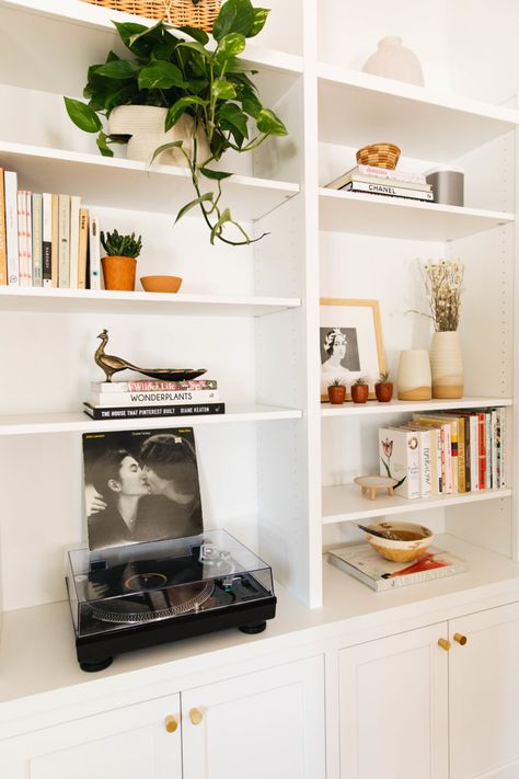 Bookcase with Record Player Built In Wall Storage Living Room, Built In Bookcase Styling, Living Room Record Player Spaces, Record Player Shelves, Built In Record Shelves, Record Player Shelf Wall, Built In Shelves Behind Couch, Built In Record Storage, Record Player On Bookshelf