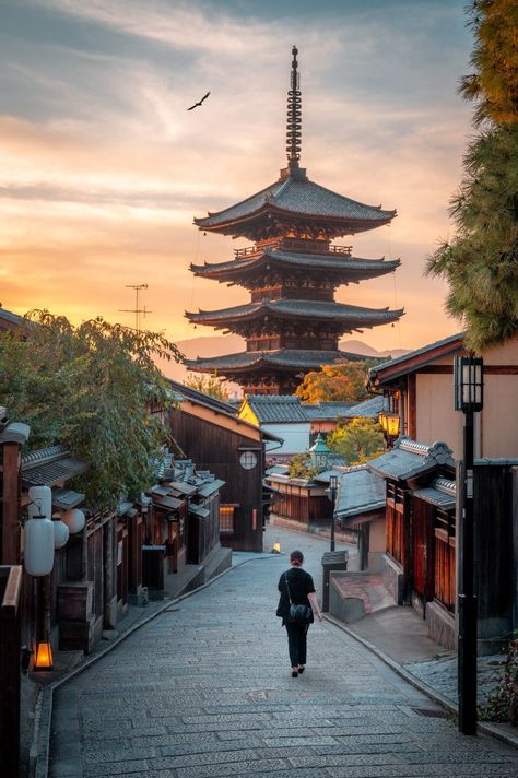 'A woman walks towards the Yasaka Pagoda at sunset.' | | https://www.picfair.com/ | | JAPAN ASIA ASIAN PAGODA YAKASA KYOTO SUNSET Kyoto Sunset, Asian Pagoda, Sunset Architecture, Pagoda Temple, Sunset Captions, Andrew Smith, Japan Architecture, Photography Store, Japan Aesthetic