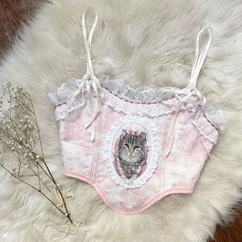 #aesthetic #corset #handmade #depop #smallbusiness #sewing #vintage #raggedyann #lace #cute #tiktok #womensclothing #whimsical #fairycore #cottagecore #coquette #dollcore #softaesthetic #balletcore Craftcore Fashion, Cat Corset, Corset Handmade, Corset Outfit Aesthetic, Aesthetic Corset, Coquette Corset, 80s Inspired Outfits, Corset Outfits, Sewing Vintage