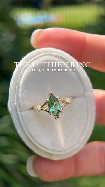 Brianna Trudell on Instagram: "Something a little different for you guys, THE LÚTHIEN ✨🌙🧝‍♀️ (And this name may or may not be a play on a certain ACOTAR character 😂) ✨1.1 CT custom cut marquise teal/green tourmaline ✨14K yellow gold ✨natural diamond accents #rings #engagementring #uniqueengagementring #ringsofinstagram #alternativeengagementring #lavendercreekgems #gemstonejewelry #tourmalinering #tourmalineengagementring #rings💍 #finejewelry" Marquise Engagement Ring Gold, Character Instagram, Trendy Engagement Rings, Green Engagement Rings, Gem Engagement Rings, Tourmaline Engagement Ring, Fairy Ring, Arm Jewelry, Paper Ring