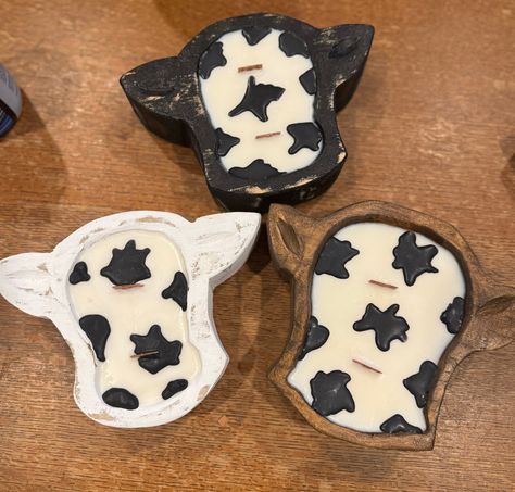 Mini cow head dough bowl candle, looks great on any table! these super cute dough bowls are perfect for any cow lover! Plus looks great and adds a touch of rustic charm. The candle is made with clean burning wicks and 100% soy wax, made in America. These are hand made to order in small batches, making each candle unique and one of a kind.  Made with clean fragrances that are phalate and paraben free and smell amazing!  They have 2 wood wicks for a cozy and clean burn. And even crackle for an even more relaxing atmosphere.  These are all hand made bowls and will have some slight differences from the pictures.  Approximately 8" by 7" wide by 2" high, and hold approximately 8oz of wax. Dough Bowl Candles Cow Print, Farmhouse Western, Candle Unique, Western Candles, Western Birthday Party, Country Candle, Mini Cows, Dough Bowls, Wooden Dough Bowl