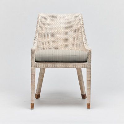 What beachy dreams are made of, the Boca dining chair is crafted of rattan and features aged brass hardware for a sophisticated touch. Frame Color: White Wash, Upholstery Color: Straw Faux Linen Interlude Boca Side Chair - Dining Chairs in White | Size 35.0 H x 21.5 W x 24.5 D in | Perigold Aged Brass Hardware, Console Table Accessories, White Dining Chairs, Chair White, Rectangular Rugs, Kitchen & Dining Chairs, Furniture Dining Chairs, Bistro Table, Side Chairs Dining