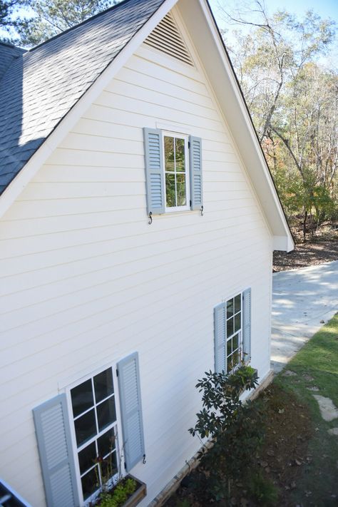 Pale Blue Shutters White House, Cream House Blue Shutters, Dusty Blue Shutters, Periwinkle Shutters, Blue Shutters White House, Green Window Trim, White House Blue Shutters, Light Blue Shutters, White House With Blue Shutters