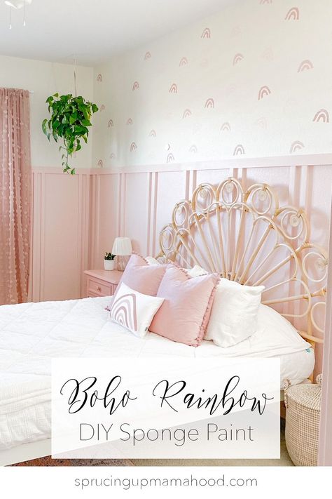 This is the CUTEST little girl's bedroom! These sponge paint boho style rainbows look just like wallpaper! #girlsroom #girlsbedroom #pinkbedroom #spongepaint #bohobedroom #bohonursery #rainbowbedroom #rainbowwallpaper #bohowallpaper #girlsbedroomdesign Sponge Paint Wall, Pink Board And Batten, Girls Pink Bedroom, Sponge Paint, Rainbow Bedroom, Pink Board, Girls Room Wallpaper, Pink Bedroom For Girls, White Bed Frame