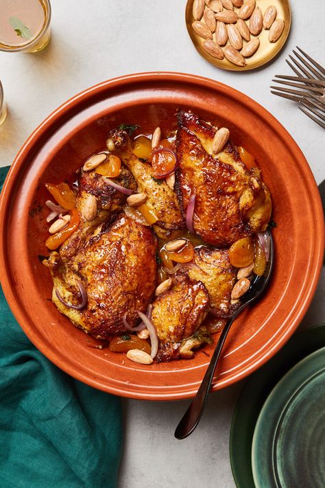 Created by chef Baija Lafridi at Jnane Tamsna in Marrakech, this Moroccan chicken tagine recipe is both savory and a little bit sweet, thanks to the addition of dried apricots. For this chicken tagine recipe, a passel of warm spices—including cinnamon, ginger, turmeric, and black pepper—complement the sweetness of the dried fruit and infuse the meat with a luscious flavor and aroma. Tagine Recipes Chicken, Venison Casserole, Chicken Apricot, Panini Recipes Chicken, Almonds Recipe, Apricot Recipes, Chicken Tagine, Apricot Chicken, Tagine Recipes