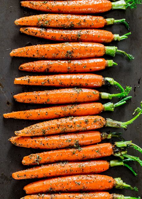 Garlic and Herb Roasted Carrots - these carrots are roasted to perfection with lots of garlic and herbs such as thyme, basil and oregano, creating the perfect side dish. Herb Roasted Carrots, Roasted Carrots Recipe, Jo Cooks, Carrot Recipes, Roasted Asparagus, Garlic Herb, Roasted Carrots, Vegetable Sides, Perfect Side Dish