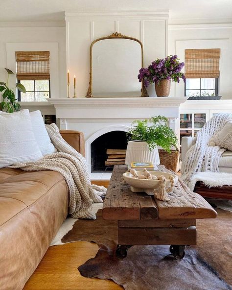 Coffee Table In Front Of Fireplace, White Living Room Leather Couch, Toni Marianna Mogensen, White Fireplace Mantle Ideas, Leather Couch Cottage Style, Couch Next To Fireplace, Faux Leather Couch Living Rooms, Coffee Table With Leather Couch, Cozy Leather Couch Living Rooms