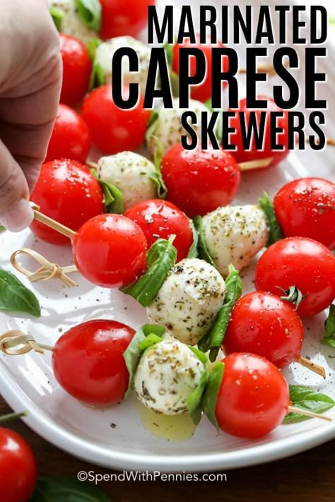 Caprese skewers are a tasty combination of cherry tomatoes, mozzarella balls, and fresh basil, then drizzled with a balsamic glaze. They are the perfect mini appetizer to serve at your next party or gathering. #spendwithpennies #capreseskewers #caprese #appetizer #miniappetizer Mozzarella Appetizers, Tomato Skewers, Caprese Appetizer, Caprese Salad Skewers, Marinated Cheese, Ensalada Caprese, Mozzarella Balls, Tomatoes Mozzarella, Skewer Appetizers