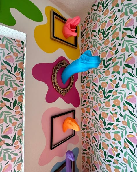 Many of Kaarin's designs and ideas have gone viral on <a href="https://www.instagram.com/kaarinjoy">Instagram</a> and <a href="https://www.tiktok.com/@kaarinjoy">Tiktok</a>, like this dinosaur head wall. Credit: <a href="https://www.instagram.com/kaarinjoy/">Kaarin Joy</a> Creativity Wall Art, Self Design Wall, Wacky Living Room, Eclectic Wall Painting Ideas, Playful Home Design, Art Room Wall Decor, Colorful Wall Ideas, Art How Aesthetic, Decoration Wall Ideas