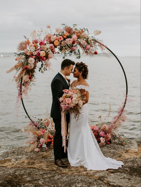 Circle arch, elopement by the ocean, flower arch, elopement inspiration, bright florals, floral circle arch, vancouver elopement, vancouver wedding ceremony, colourful floral arch #floralarch #elopementphotographer #elopementideas Wedding Arch Round, Circle Wedding Arch, Boho Wedding Arch, Beach Wedding Arch, Circle Arch, Wedding Alters, Wedding Arbor, Wedding Hoop, Wedding Ceremony Arch