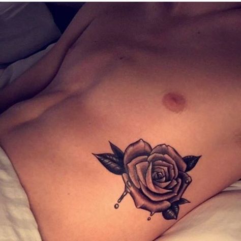 Tanner Braungardt Rose tattoo Tanner Braungardt, Rose Rib Tattoos, Rose Gold Tattoo, Flower Tattoo On Ribs, Rib Tattoos For Guys, Rose Tattoo Thigh, Surf Tattoo, Rose Tattoos For Men, Men Tattoos Arm Sleeve