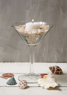 Top 7 Inexpensive Centerpiece Ideas Inexpensive Centerpiece Ideas, Martini Glass Centerpiece, Beach Theme Candles, Inexpensive Centerpieces, Seashore Decor, Themed Centerpieces, Navy Ball, Floating Candles Bowl, Holiday Table Centerpieces