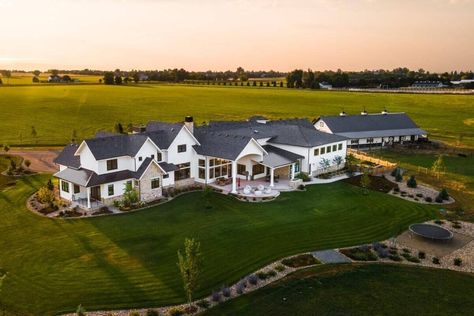 Aerial rear view of the house showcasing its expansive outdoor space and serene landscaping. Farm Dream House, House With Acreage, Massive Farmhouse, Big Ranch House, Luxury Homestead, Millionaire Houses, Farm Mansion, Farmhouse Mansion, Huge Farmhouse