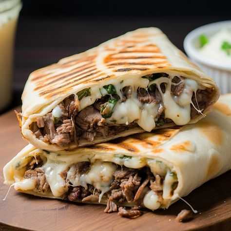 A delicious and easy-to-make grilled wrap filled with all the flavors of a Philly Cheesesteak sandwich. Cheesesteak Wrap Philly, Steak And Cheese Wraps, Philly Wrap, Steak Wraps Recipes, Roast Beef Wrap, Blade Roast, Cheesesteak Sandwich, Steak Wraps, Steak And Rice