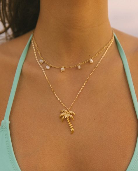 Classy, yet bold, the Royal Palm Necklace is a staple year round! This stylish, dainty chain paired with the shiny pop of the palm is the perfect pair. This 24k gold plated necklace is perfect for swimming in the ocean sunrise to sunset! 18-20in Aesthetic Jewelry Gold, Beachy Jewlery, Palm Necklace, Swimming In The Ocean, Ocean Sunrise, Coastal Jewelry, Surf Jewelry, Classy Necklace, Beachy Jewelry