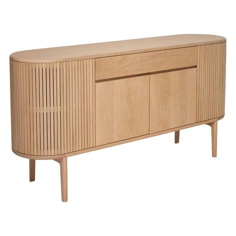 The Ercol Siena sideboard is a statement piece that offers plenty of storage space with a useful middle drawer and a cupboard with an adjustable shelf placed in between curved, slatted cupboards that frame the cabinet ends and have a practical push close mechanism. Available in a choice of pale oak or a rick dark finish. #ERCOL #SIDEBOARD #MINIMAL #SCANDI #COTTAGECORE #INTERIORS Scandi Cottagecore, Ercol Sideboard, Pale Oak, Footstool Coffee Table, Recliner Corner Sofa, Wood Sample, Dining Room Storage, Leather Recliner, Adjustable Shelf