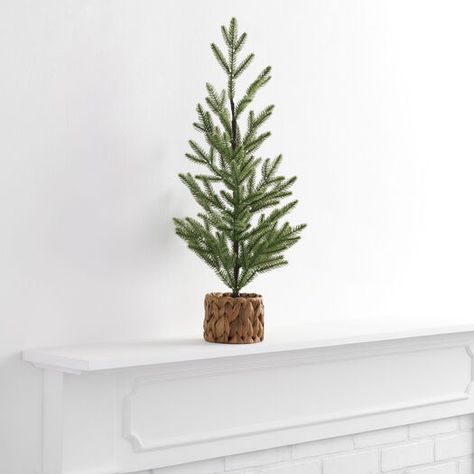 Mini Faux Christmas Tree in Basket Decor by World Market Small Christmas Tree In Basket, Christmas Tree Riser, Decorating Shelves For Christmas, Modern Holiday Decor Christmas, Tree In Basket, Faux Christmas Tree, Christmas Tree In Basket, Mini Christmas Tree Decorations, Scandinavian Table