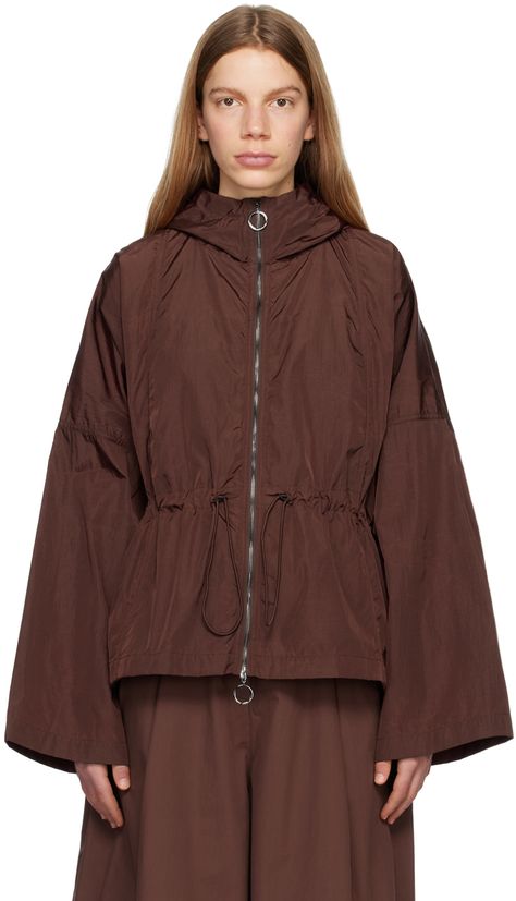 Lightweight water-repellent nylon ripstop jacket. · Hood at stand collar · Two-way zip closure · Gathering at waist · Bungee-style drawstrings at waist · Seam pockets · Unlined Supplier color: Chestnut Winter Styling, Sports Wear Women, Studio Nicholson, Women Sports, Sports Wear, Styling Ideas, Sport Wear, Sport Fashion, Stand Collar