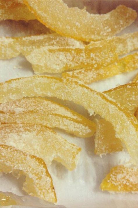 Candied Lemon Peel | "This is a good way to use up lemon rind and it goes good with coffee or on cake. It really does taste like candy, and you can do this to ANY citrus fruit. If you use oranges you can add brandy, cloves or other spices the mixture. Chop it up and put it in cookies, or just eat it by itself." #dessertrecipes #dessertideas #lemon #lemonrecipes #lemondesserts Lemon Peel Recipes, Lemon Juice Benefits, Candied Lemon Peel, Candied Orange, Lemon Benefits, Candied Lemons, Just Eat, Candied Fruit, Lemon Rind