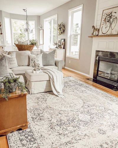 Beautiful farmhouse cottage style livingroom home with grey walls (Rodda Rand Moon is the color) honey oak floors, shiplap fireplace, and white and neutral decor pieces. Lots of vintage decor and antique furniture pieces with a cozy shabby interior design. This rug is the Ozona Area Rug from Boutique Rugs. rainandpine55 will save you 55% - Rain and Pine Honey Oak Floors, Golden Oak Floors, Oak Floor Living Room, Color Walls, Shiplap Fireplace, Farmhouse Fireplace, Oak Bedroom, Honey Oak, Estilo Country