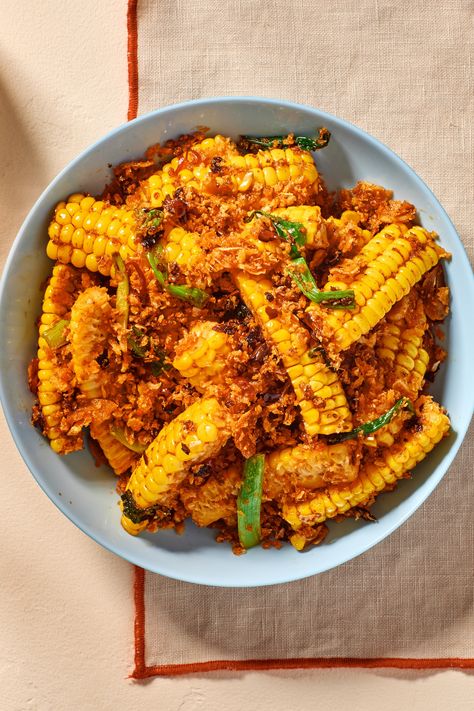 These corn ribs are great on their own, but even better with the garlicky-spicy-aromatic-electrifying crispy breadcrumb mixture on top. "Typhoon shelter-style” has become a technique that can be applied to a myriad of ingredients, from shellfish to vegetables and even fried rice. Different chefs prepare it differently as well. But the common denominator remains the sheer intensity of the dish: a whopping amount of minced and fried garlic, wok hei, and a deep, sustaining, fiery spice. Corn Ribs Recipe, Corn Ribs, Starchy Sides, Apartment Recipes, Recipes Corn, Cantonese Cuisine, Wok Cooking, Sides Dishes, Summertime Recipes